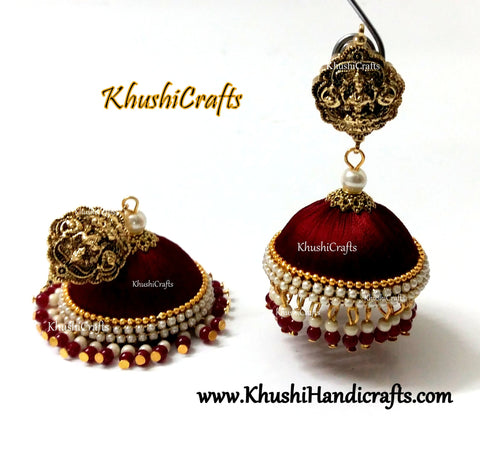 Maroon Designer Extra large Silk Jhumkas enhanced with a Lakshmi Stud and Gungaroos attached