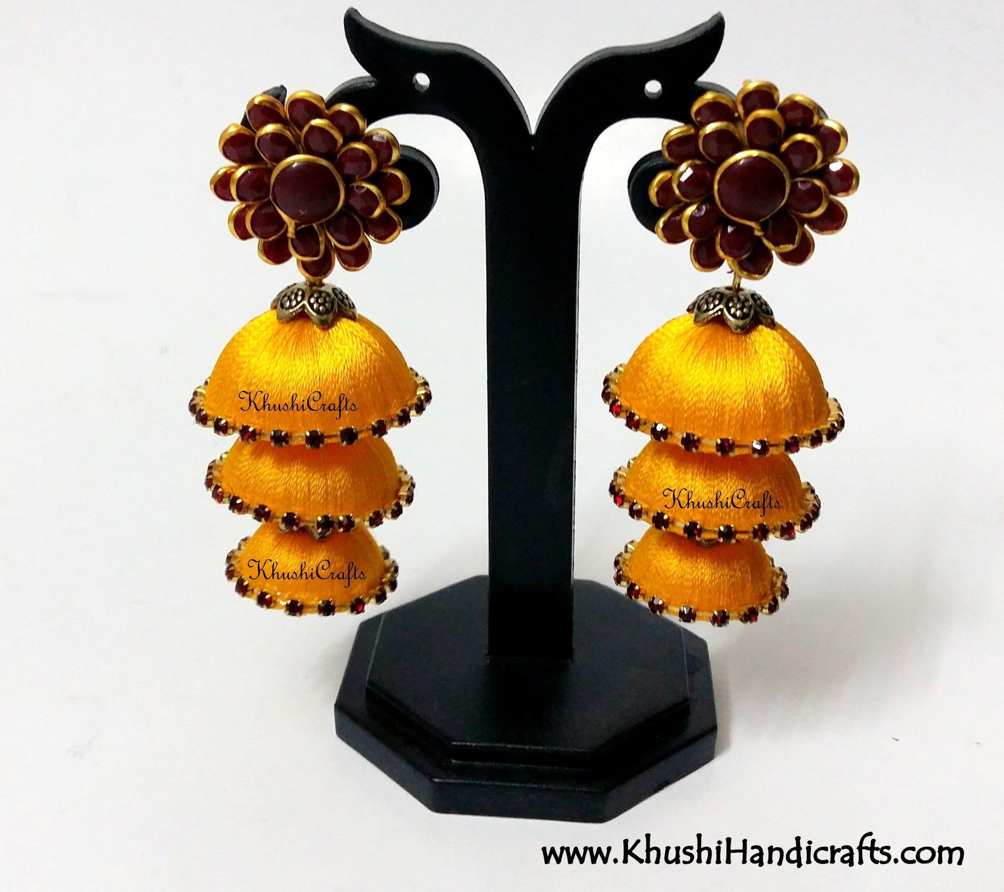 Yellow Cascaded Jhumkas in Silk with Pachi Stud