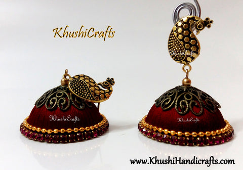 Red Designer Extra large Silk Jhumkas enhanced with a Peacock Stud
