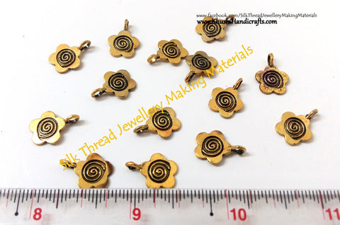 Antique Small Gold Flower charms.Sold as a set of 10 pieces!