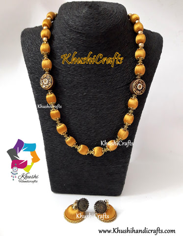 Silk Thread Jewelry in Gold shade complimented with Kundan work Wooden Moppu!