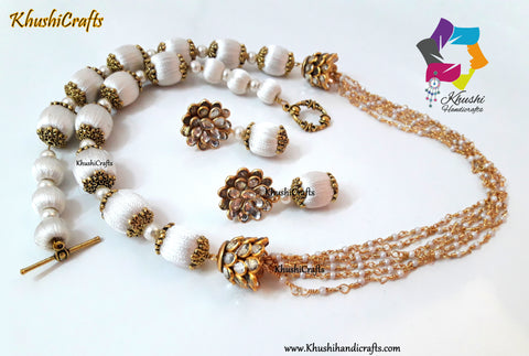 Off White Silk Thread Jewelry Set with Pearl linked chain complimented with Pachi spacers!