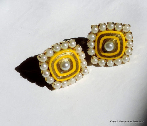 Yellow studs with pearl lining