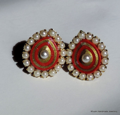 Red studs with pearl lining