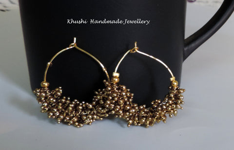 Handcrafted gold hoops