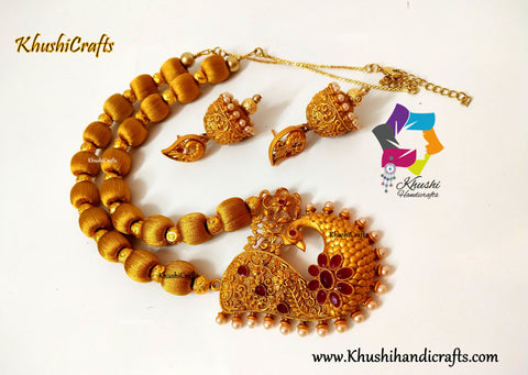 Silk thead Necklace in Gold shade with Peacock Pendant and complimentary handmade Jhumkas